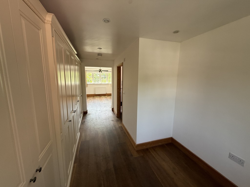 Lot: 168 - DETACHED COTTAGE IN ESSEX VILLAGE LOCATION - Dressing room at the entrance to bedroom 1